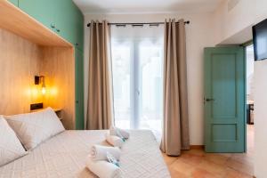 a bedroom with a bed and a large window at Apartamento Isaac Peral 2 in Chipiona