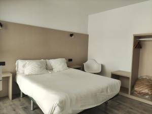 Łóżko lub łóżka w pokoju w obiekcie Hotel Hórreo by Bossh! Hotels