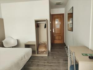 Łóżko lub łóżka w pokoju w obiekcie Hotel Hórreo by Bossh! Hotels