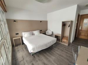 Łóżko lub łóżka w pokoju w obiekcie Hotel Hórreo by Bossh! Hotels