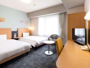 TV a/nebo společenská místnost v ubytování Comfort Hotel Naha Prefectural Office