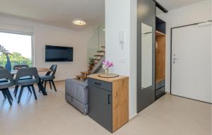 a kitchen and dining room with a table and chairs at 2 Bedroom Awesome Apartment In Nin in Nin
