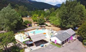 an overhead view of a swimming pool in a park at Camping 3 étoiles - Piscine - eeed0b in Bédouès