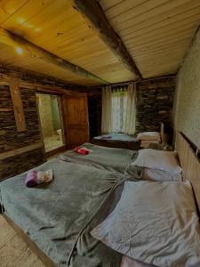 Postel nebo postele na pokoji v ubytování Pirikiti chesho