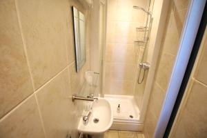 a small bathroom with a sink and a shower at Hamilton in Lincoln +32 photos