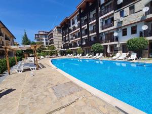 a swimming pool in front of a apartment building at Mit Prot Panorama Bay 2 luks Studio 40 in Sveti Vlas