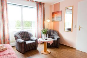 Posezení v ubytování Hotel Garni Am Deich