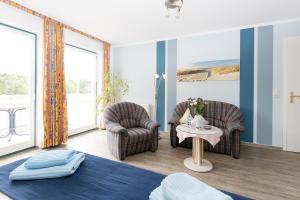 Posezení v ubytování Hotel Garni Am Deich