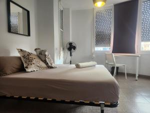 Posteľ alebo postele v izbe v ubytovaní eXperience Rooms Valencia