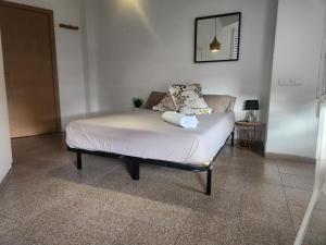 Posteľ alebo postele v izbe v ubytovaní eXperience Rooms Valencia