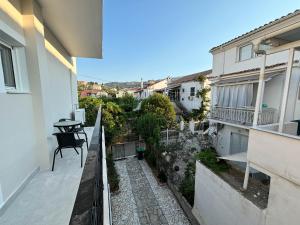 an empty balcony of a building with a table on it at Kassiopi Bella Vista in Kassiopi