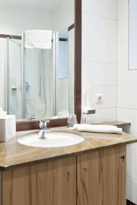 Baðherbergi á FrühstücksHotel Scharinger
