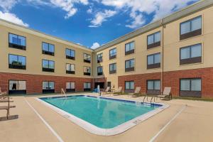 an image of a swimming pool in front of a building at Comfort Inn & Suites Chestertown in Chestertown