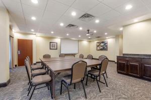 a conference room with a table and chairs and a whiteboard at Comfort Inn & Suites Chestertown in Chestertown +35 photos