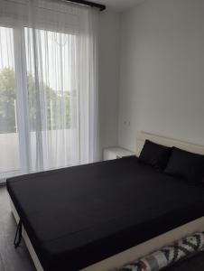 Posteľ alebo postele v izbe v ubytovaní Híd Köz Penthouses Apartman