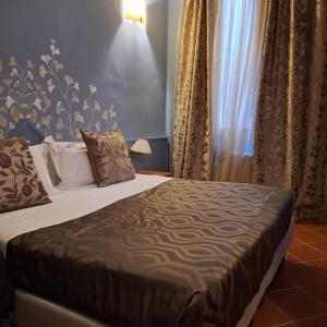 Postel nebo postele na pokoji v ubytování Hotel Maxim Axial