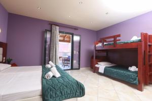 Posteľ alebo postele v izbe v ubytovaní Kerkyra Beach Hotel & Apartments