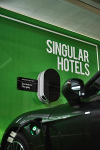 a green sign that says singular hotels on the side of a car at SH Villa Gadea in Altea