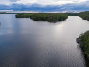 an aerial view of a large body of water at Metsäsydän mökki 1 Minttumaari in Puumala +26 photos