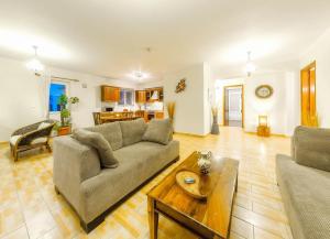 a living room with a couch and a table at Parys Villas in Tsilivi