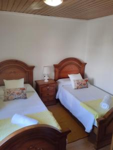 two beds sitting next to each other in a bedroom at Casa de Valeria in Tomiño +13 photos