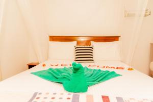 Postel nebo postele na pokoji v ubytování Aroma Heaven Homestay