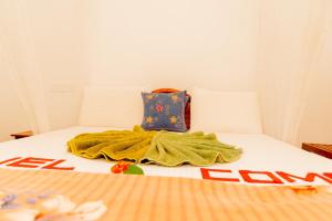 Postel nebo postele na pokoji v ubytování Aroma Heaven Homestay