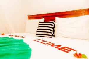 Postel nebo postele na pokoji v ubytování Aroma Heaven Homestay