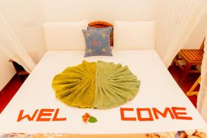 Postel nebo postele na pokoji v ubytování Aroma Heaven Homestay