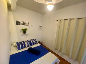 Cama ou camas em um quarto em Térreo Praia Grande