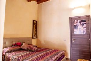 Postel nebo postele na pokoji v ubytování B&B Piazza Noua 1831
