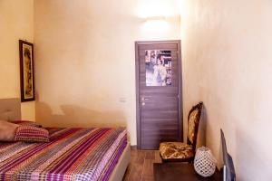 Postel nebo postele na pokoji v ubytování B&B Piazza Noua 1831