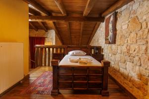 Postel nebo postele na pokoji v ubytování Akritas Ef Zin Villas & Suites + 37 fotografií