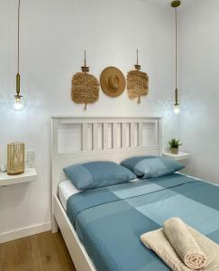 En eller flere senge i et værelse på UIM Mediterraneo CASA Gomez Ferrer Wifi