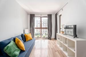 Televízia a/alebo spoločenská miestnosť v ubytovaní Chill Apartments Jana Kazimierza