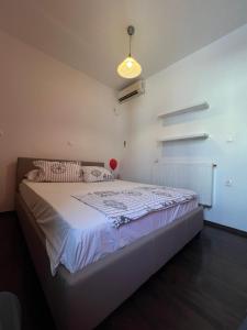 a bedroom with a large bed in a room at colored houses in Ierapetra