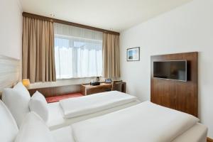 Postel nebo postele na pokoji v ubytování Austria Trend Hotel Salzburg Messe