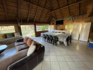 a large living room with a table and chairs at Zomoya Game Farm in Vaalwater +43 photos