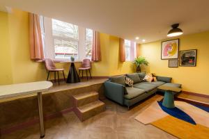 a living room with a couch and a table at Aaron Wise - 51 Fitzhamon Apartments in Cardiff
