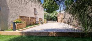 a driveway in front of a building with a fence at Villa accueillante entre Aix et Marseille in Vitrolles +52 photos