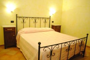 Postel nebo postele na pokoji v ubytování Agriturismo Il Vecchio Carro