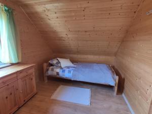 Posteľ alebo postele v izbe v ubytovaní Domek letniskowy Arkady
