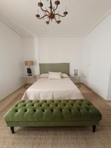 Ένα ή περισσότερα κρεβάτια σε δωμάτιο στο Apartamento Villalonga