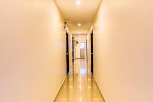 a long hallway with a long corridor at FabExpress Mayuri Residency in Bangalore