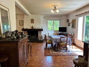 a kitchen with a table and a dining room at 763 - Maison bretonne en bord de mer in Erquy