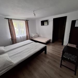 Postel nebo postele na pokoji v ubytování Cabana Valea Arieșului