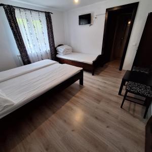Postel nebo postele na pokoji v ubytování Cabana Valea Arieșului