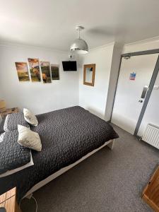 a bedroom with a bed in a room at Self Catering Spacious open plan 3 bed apartment with sea views in South Erradale