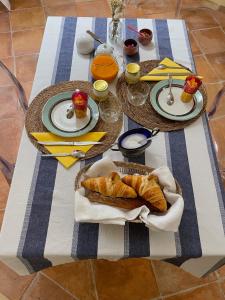 a table with two plates of food on it at LE CLOS DE LA CATHEDRALE in Bazas
