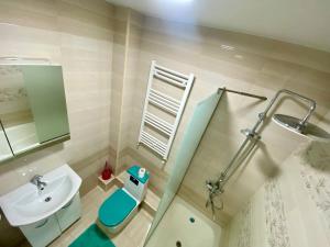 a bathroom with a sink and a toilet and a mirror at Dream HOME 2 Rooms Apartment in Chişinău +26 photos
